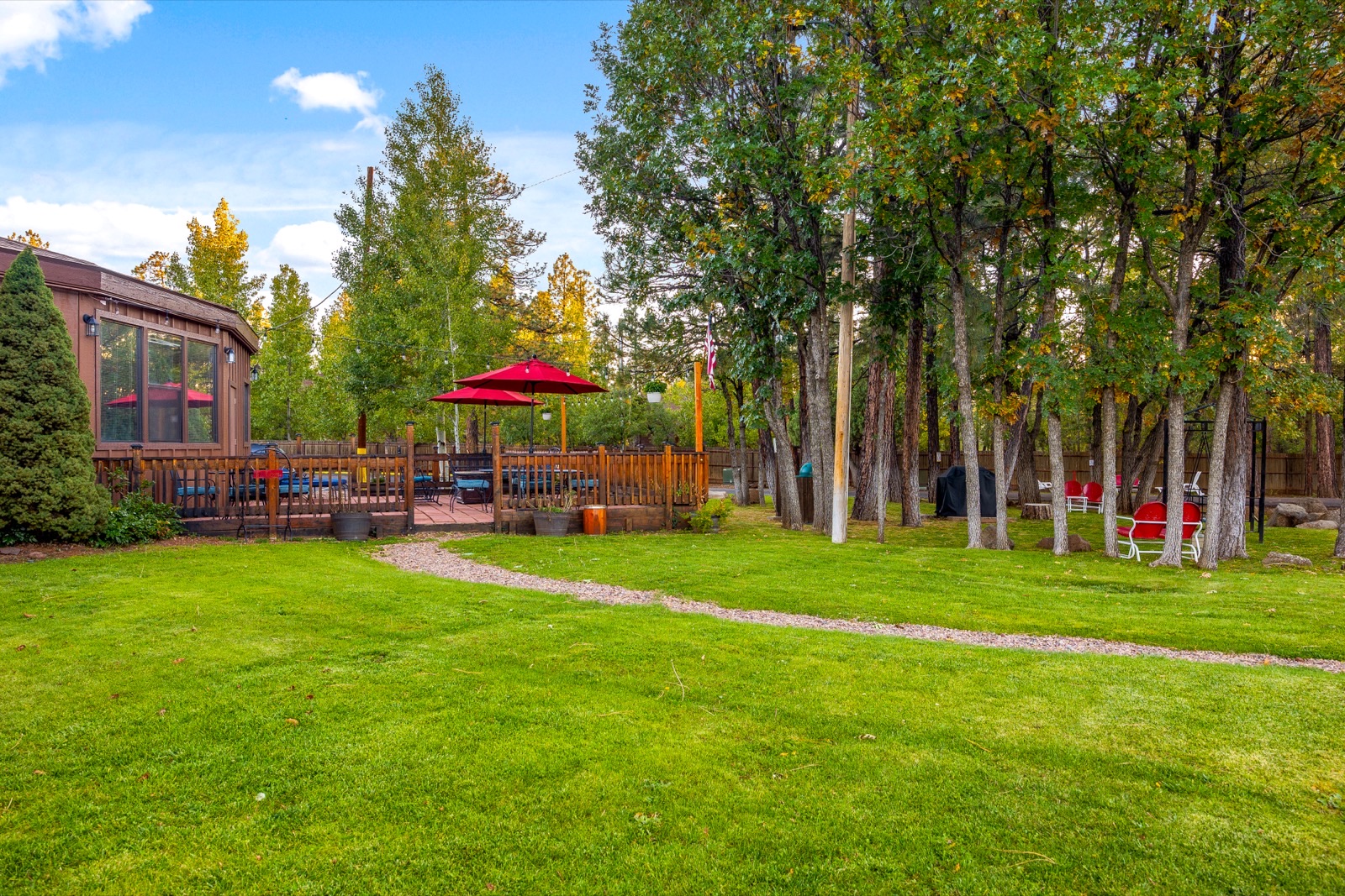 Roundhouse Residences grounds with tall pines
